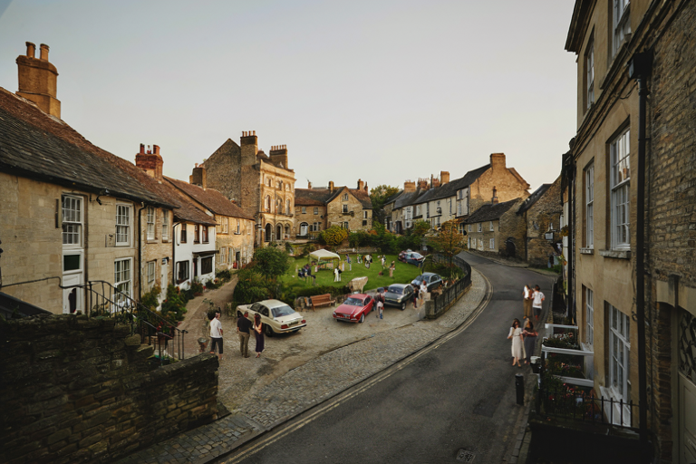 Editorial illustration of a historic village street transformed with 1990s period automobiles for a television series production.