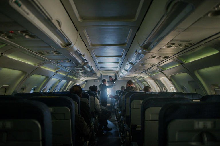 Conceptual illustration of a tense moment inside an aircraft cabin during a crisis.