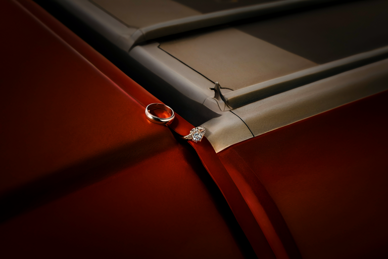 Editorial illustration of an engagement ring juxtaposed with a conceptual representation of official government aircraft structure.