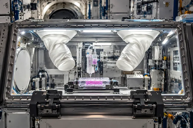 AI illustration based on reference photographs; not an event photograph. A detailed illustration of a Life Science Glovebox containing a cartridge with a cell-ink mixture inside a laboratory module.