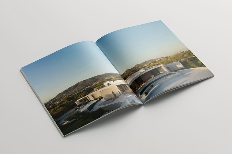 A modern property brochure displaying a luxurious Italian villa with minimalist design, set against rolling hills and a clear sky.