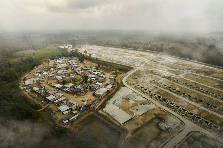 Two parcels of land showing informal settlements and a planned housing development
