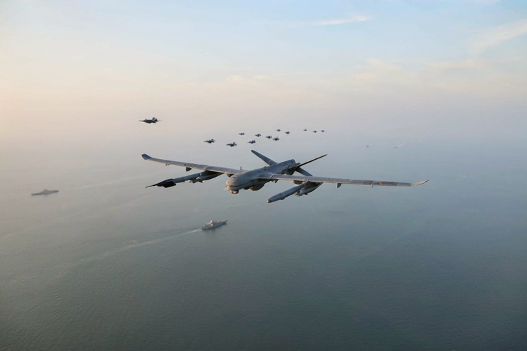 A WZ-7 drone soars over the South China Sea during military exercises.