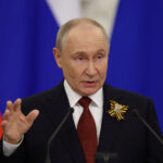 22int-putin-whisperer-01-cmlb-mediumSquareAt3X